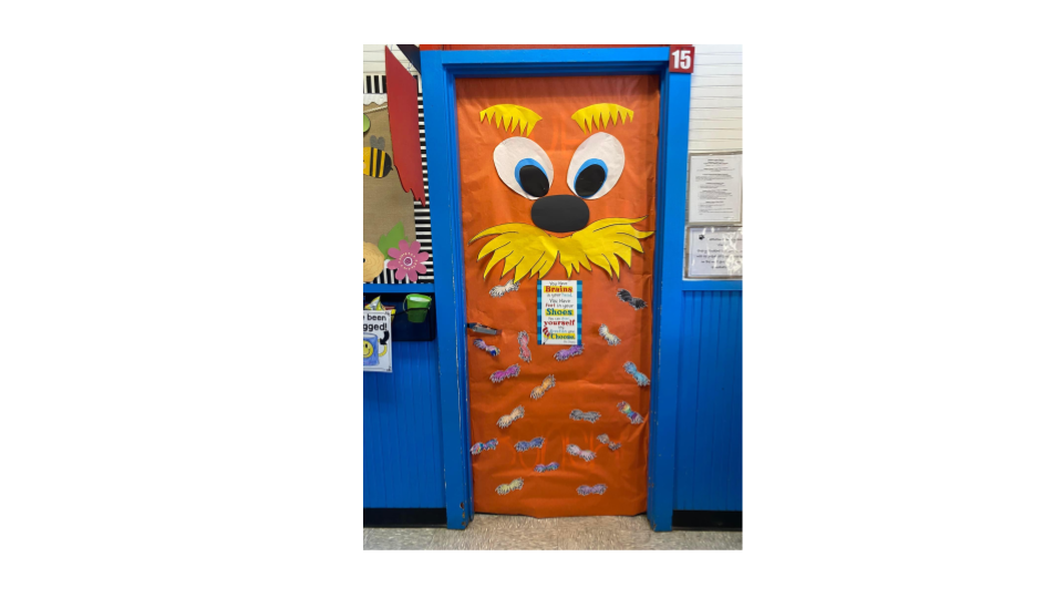 Door decorated as the lorax with the Dr. Seuss quote: "You have the brains in your head. You have feet in your shoes. You can steer yourself any direction you choose."